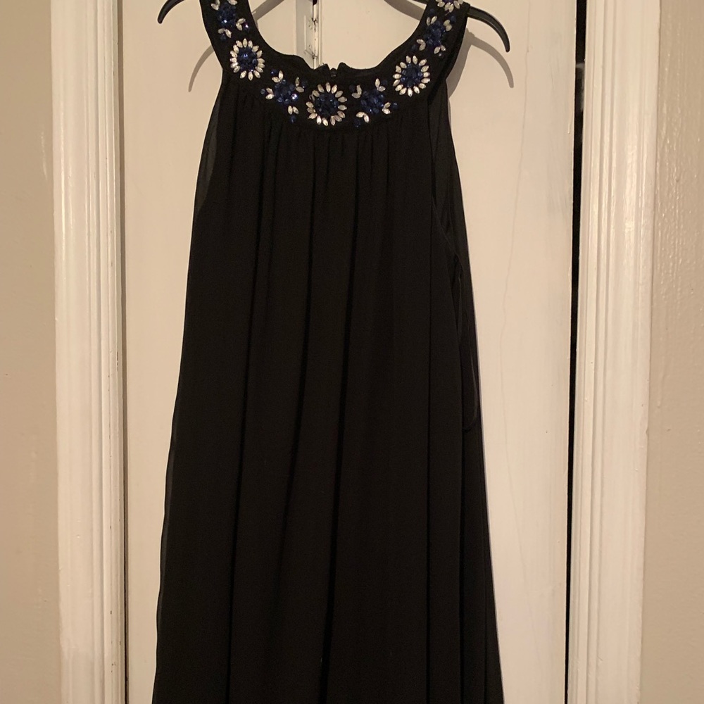 Nice black dress it has a sheer layer on top